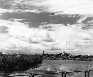 A C46 in the sky over New Guinea. Probably bringing photographs in the mail of little Shaun.