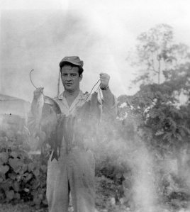 FISH FOR DINNER - Lt. Al shows off his catch. Papua New Guinea 1944