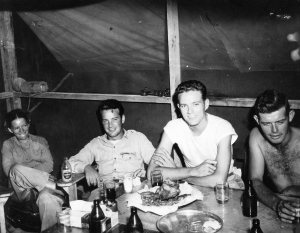 Lt. Al knocking back a few cold ones with his Signal Corps buddies. Papua New Guinea 1944