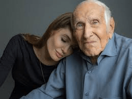 Director Angelina Jolie shown here with the real Louie Zamperini shortly before his death.